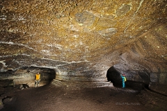 Cavers in a braided cave passage
