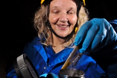 Diana putting a DNA sample into the dry ice container